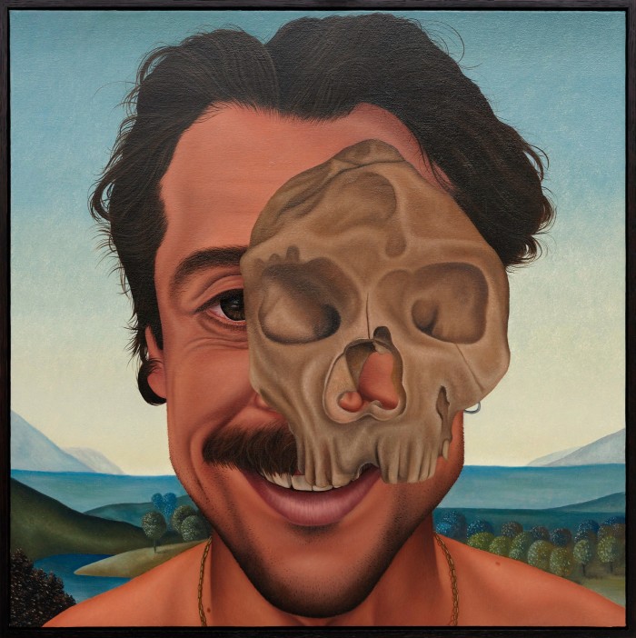 A painting of a man’s face with a  small skull superimposed over one side of the face