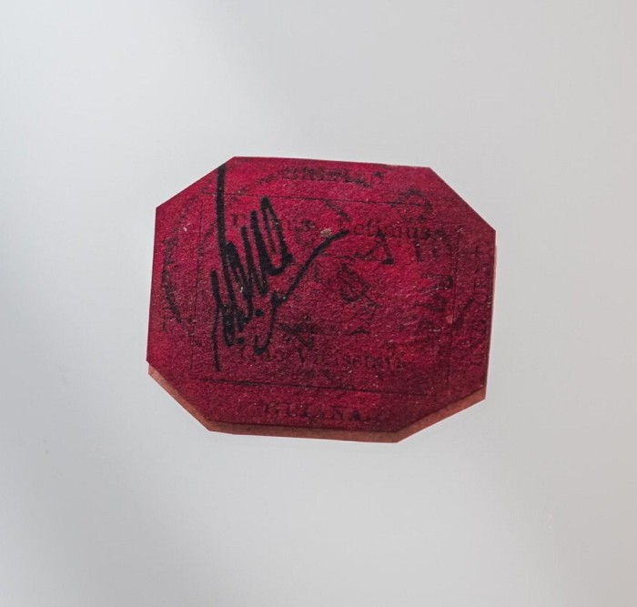 A close-up of a very rare red stamp 