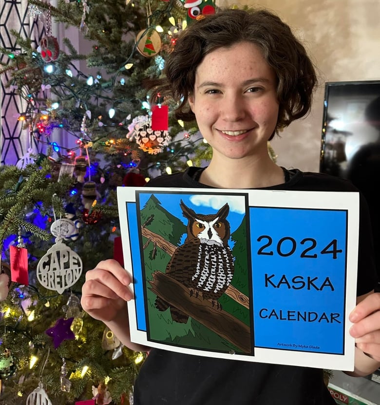 Smiling girl holding a calendar