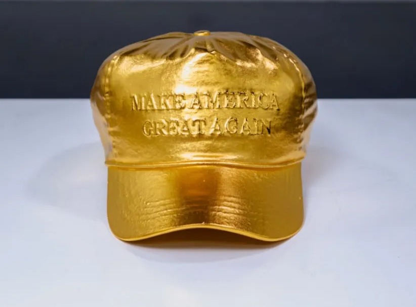 The gleaming object is made from 24-karat gold and hopes to spread the 'Make America Great Again' message in the form of art