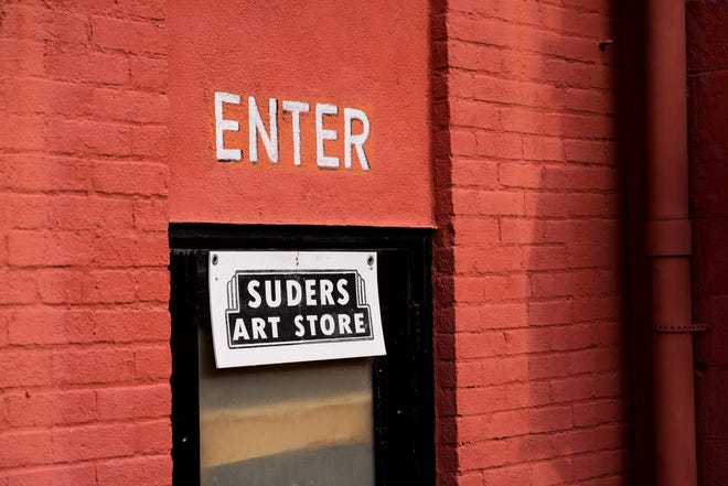 A back entrance located in the parking lot leads to the main store through the back on Tuesday, Jan. 16, 2024, at Suder’s Art Store in Over-the-Rhine.