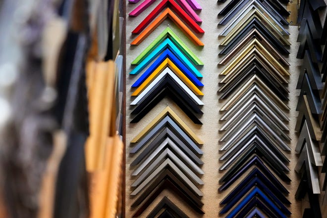 Edges of colorful and ornate frames hang on display on Tuesday, Jan. 16, 2024, at Suder’s Art Store in Over-the-Rhine. The store originally began as a frame shop and gallery, but transformed into an art store for local artists.