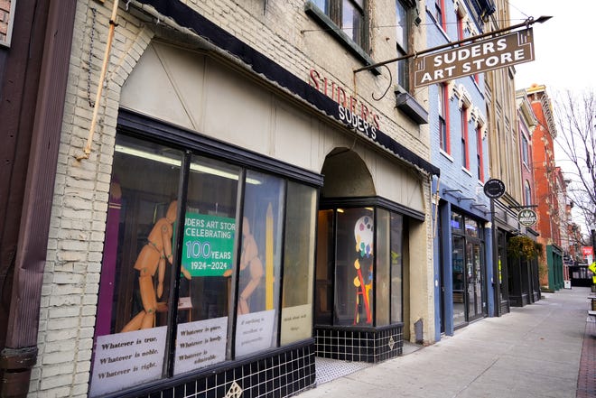 A sign in the storefront’s window reads, “Suders art store celebrating 100 years 1924-2024,” on Tuesday, Jan. 16, 2024, at Suder’s Art Store in Over-the-Rhine.