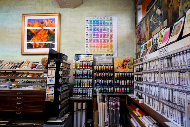 Shelves full of colorful art supplies, including different brands of acrylic paints, line the back of the art store on Tuesday, Jan. 16, 2024, at Suder’s Art Store in Over-the-Rhine.