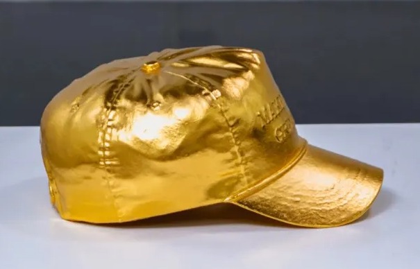 It was made by placing a red Maga hat in a 3D printer before casting it into bronze