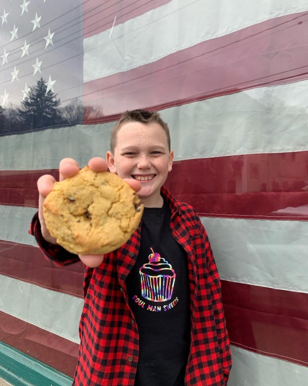 Cameron Livesay is pictured holding his signature chocolate chip cookie. (Patrice Stair photo)