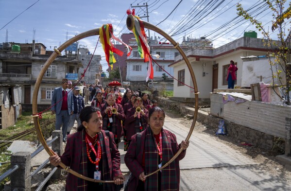Members of Shrijanshil Mahila Sanstha, or the Self-Reliant Women’s Group, lead a wedding procession in Kathmandu, Nepal, Wednesday, March 6, 2024. Discrimination based on caste is believed to have caused some musicians to quit playing naumati baja. (AP Photo/Niranjan Shrestha)