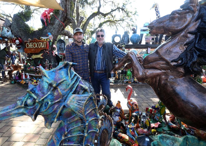 Wesslie Pendola and his dad Carlos Pendola, owner of Barberville Yard Art Emporium, Thursday February 2024.