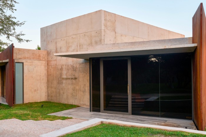 The exterior of an angular-design art gallery rendered in sandstone 