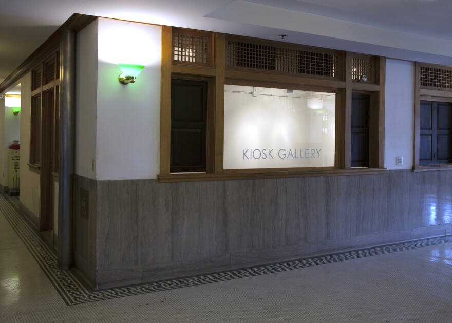 Exterior view of Kiosk Gallery, with the gallery name on the window. 