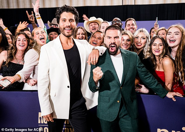 The talented tandem was posed in front of a group of fans at the event in Frisco, Texas