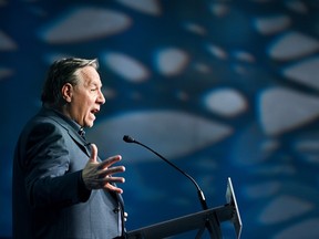 Quebec Premier François Legault speaks at a podium