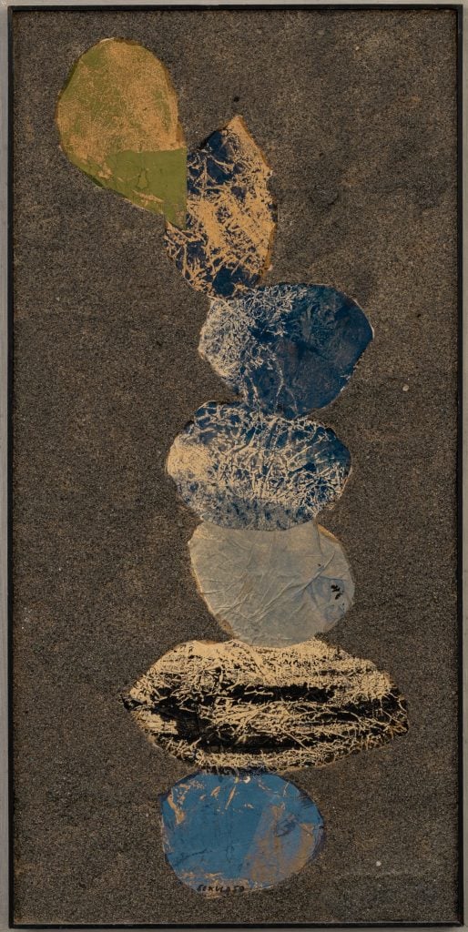 a long collage with round forms stacked on top of each other, dark palette
