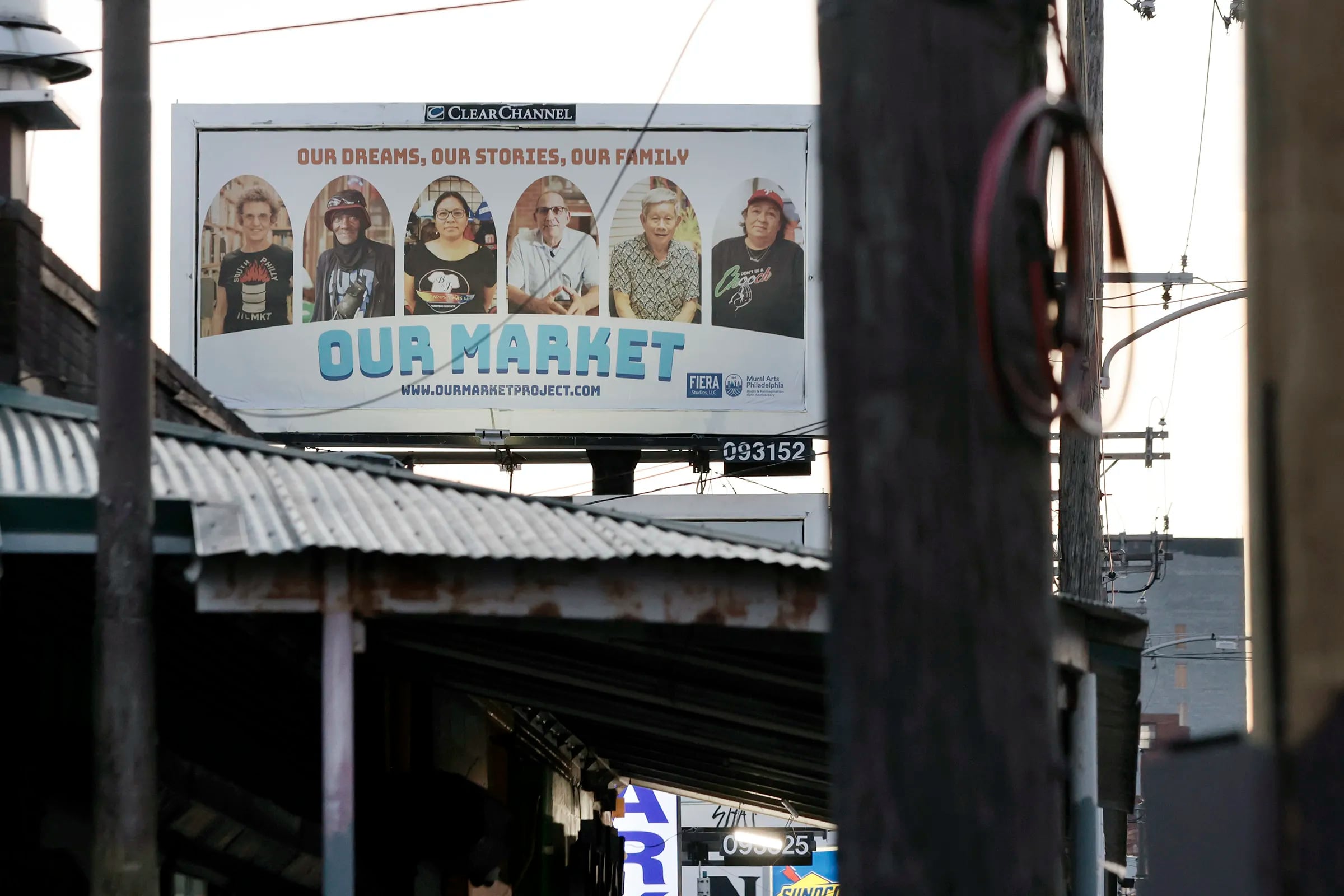 A billboard, on Washington Ave., advertising the Our Market public art project in Philadelphia on Sunday, June 16, 2024. Local artist Michelle Angela Ortiz is collecting stories of the immigrant/migrant vendors, business owners, and neighbors that work and reside in the 9th Street Market for a community building public art project titled Our Market.