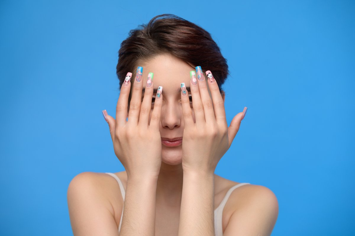 Girl Holding Up Hands with Nail Art