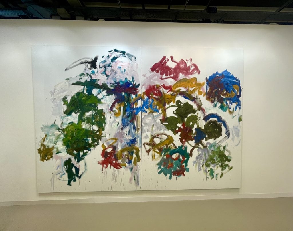 an abstract painting on a white wall