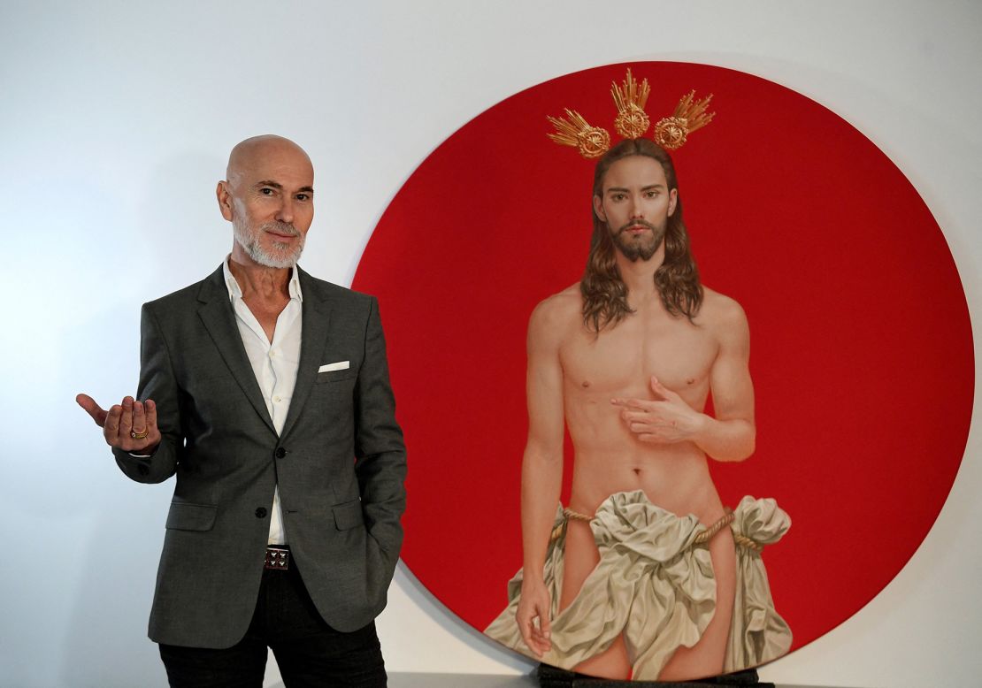 Spanish artist Salustiano García Cruz next to the Christ he painted for the official poster of 