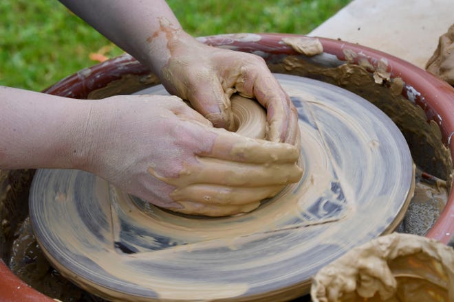 The Kentuck Art Market was held Saturday on the grounds of Kentuck’s new location on Jack Warner Parkway in Tuscaloosa. Amy Smoot molds clay on a pottery wheel.