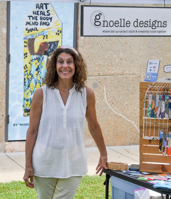 The Kentuck Art Market was held Saturday on the grounds of Kentuck’s new location on Jack Warner Parkway in Tuscaloosa. Gina Noelle waits for patrons in her booth where she displays up cycled fabric items.