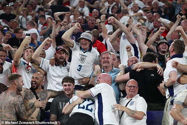 England fans celebrate the team's second goal scored by Ollie Watkins in Dortmund last night