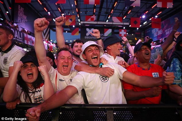 Jubilant England fans celebrate at Boxpark in Croydon, South London, on Wednesday evening