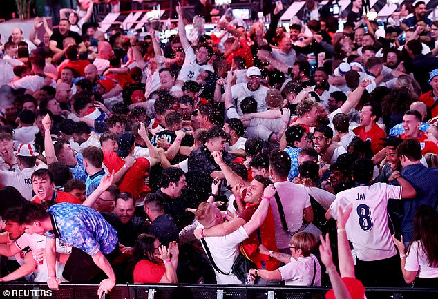 England fans celebrate at Boxpark Wembley in North West London on Wednesday evening