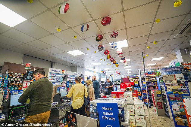 A Tesco supermarket in Wimbledon is decorated with the flags of the 24 nations at the Euros