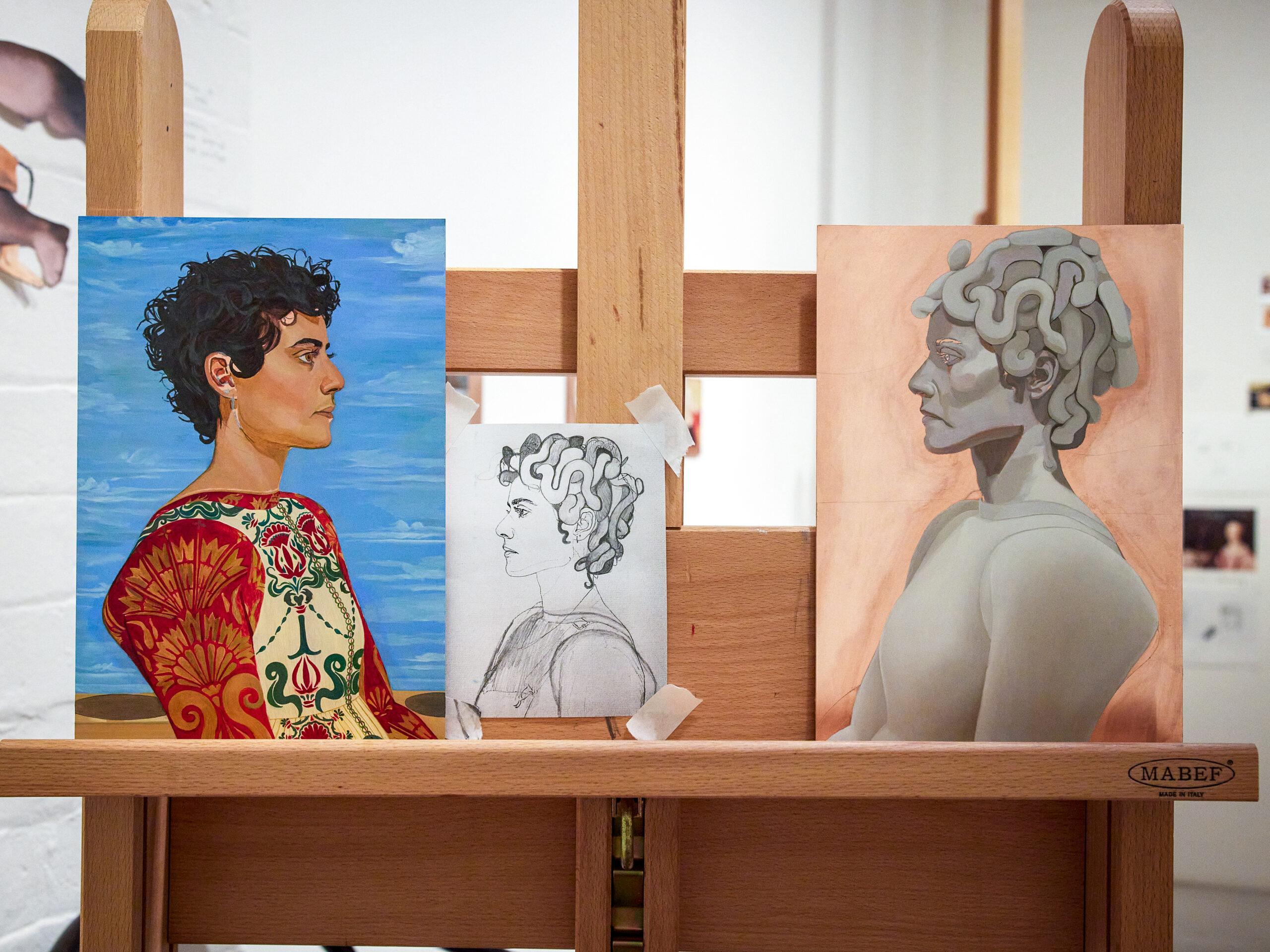 Works in progress on the artist's easel - paintings of musician Montaigne as Medusa