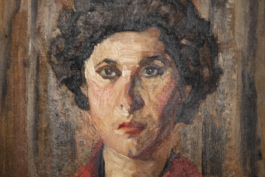 A painting of a woman with short, brown hair and a red shirt staring straight ahead with a solemn expression.