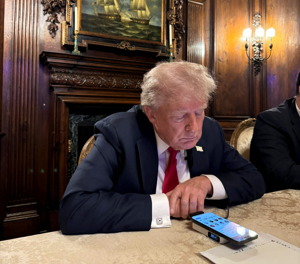 Former U.S. President Donald Trump speaks as he participates in an interview with billionaire entrepreneur Elon Musk on th...