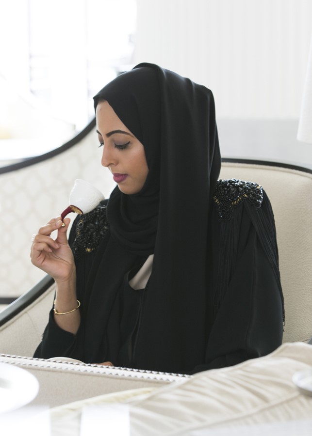 emirati-woman-smelling-perfume.jpg