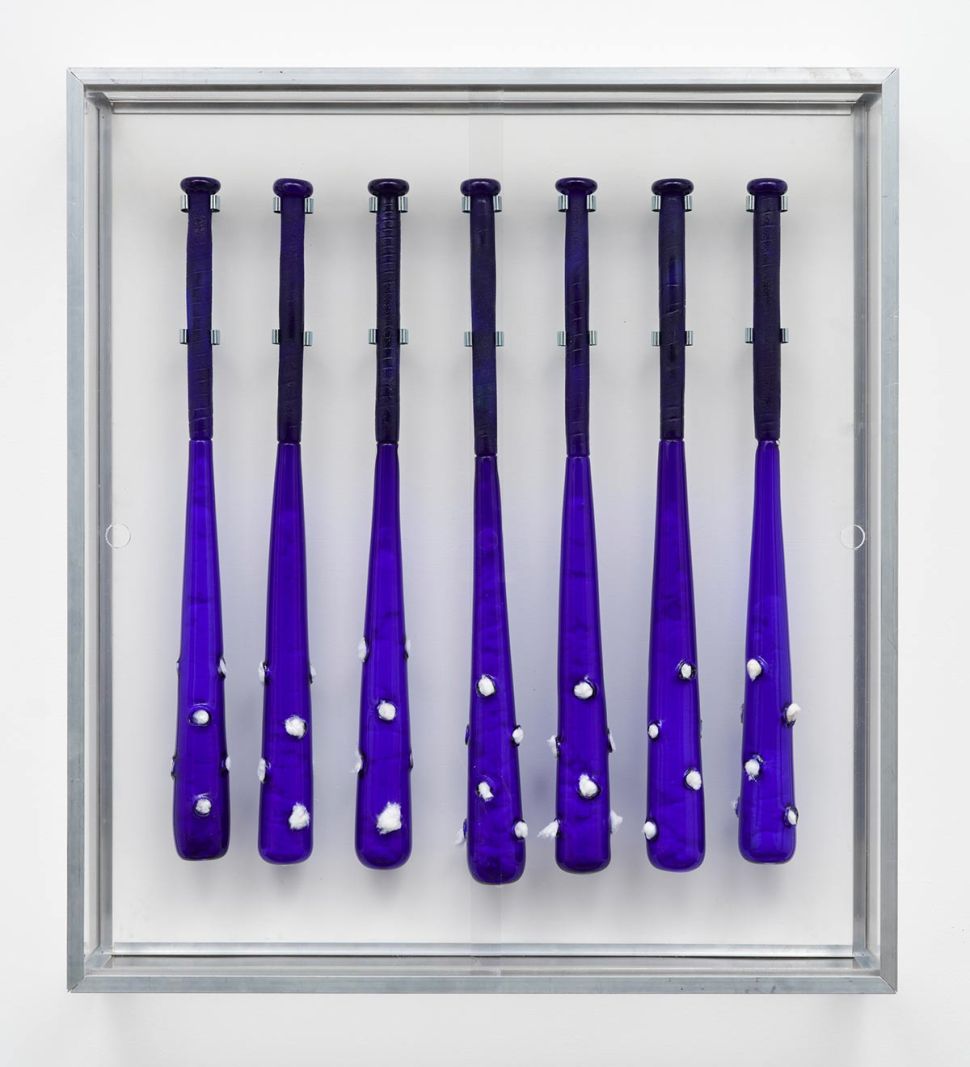 image of blue baseball bats on a vetrine