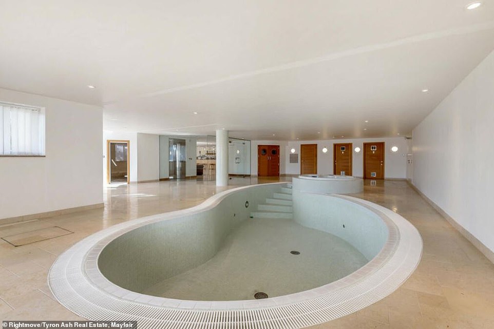 The basement level features a health suite including a heated swimming pool with adjoining Jacuzzi, steam room, poolside shower and changing rooms