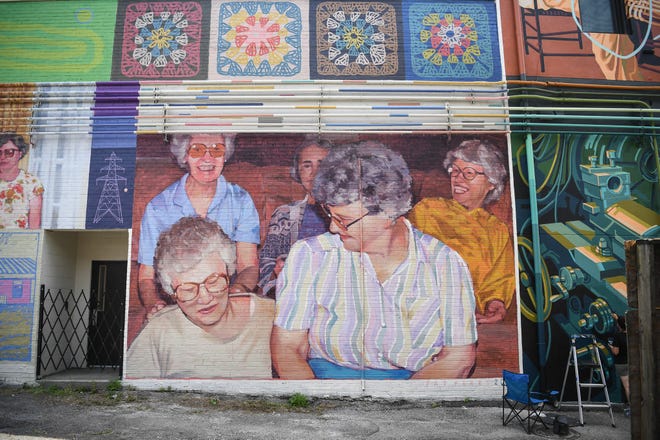A mural by artist Pat Perry adorns a building wall for KnoxWalls at Emory Place in Knoxville, Thursday, August 15, 2024. The immersive joint art collaboration from artists based nationwide will open to the public in Knoxville on Friday, Oct. 4.