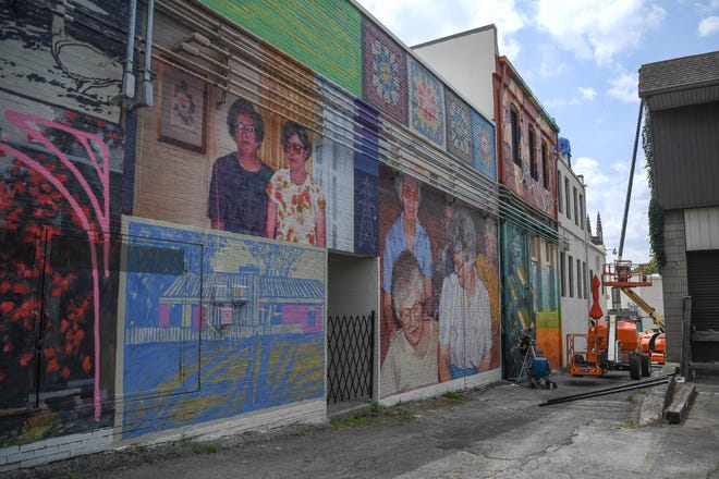 Work is underway for KnoxWalls at Emory Place, an immersive joint art collaboration of artists who have travelled from all over the country to create the outdoor art destination, Knoxville, Thursday, August 15, 2024. Dogwood Arts, Visit Knoxville, and the Lilienthal Gallery are sponsoring the local project; members of the public will be able to view the collaborative artwork on Friday, Oct. 4.