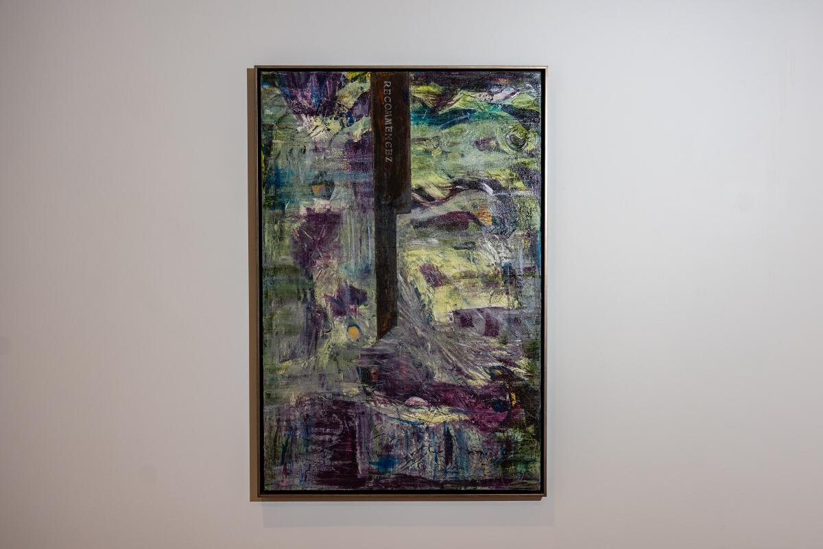 Another abstract painting has a shaft of black paint entering a field of purple, yellow and green.