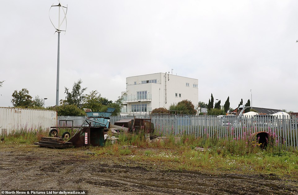 The house shares a boundary with a warehouse and a municipal tip which isn't the best view
