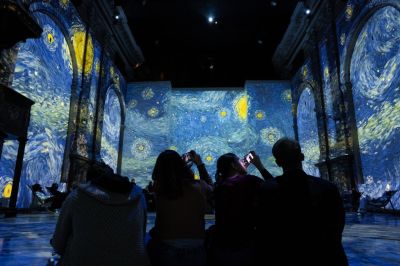 NAPLES, ITALY - JANUARY 2: People visit the 'Van Gogh: The Immersive Experience' exhibition at the Church of San Potito as the 170th anniversary of Van Gogh's birth is celebrated in Naples, Italy on January 2, 2023. The 