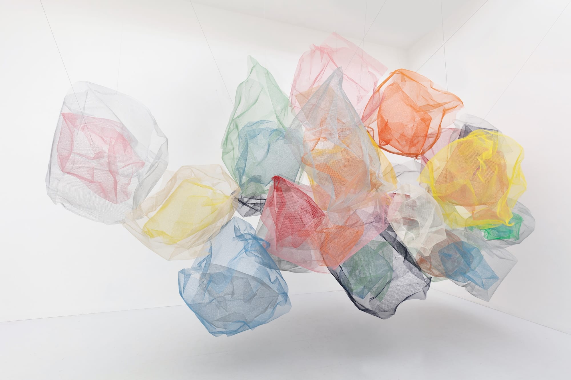 a suspended, abstract, billowing textile sculpture by Rana Begum made of pieces of toile fabric