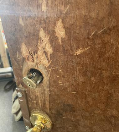 Axe damaged lock on door of art gallery. Photo credit Ian Tanner