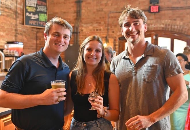 Luke Pauldine, Rita Wilkin, Hayden Beck at the West End Social networking event at New Realm Brewing Co. in Downtown Greenville. Young professionals in the Greenville area connected with West End business owners and community leaders over delicious food and drink. Partners for the event included RingoFire, TALK Greenville magazine, Modal Coffee & Hostel, Corsica Technologies, Greenville Bike Taxi and Clayton's Deli.