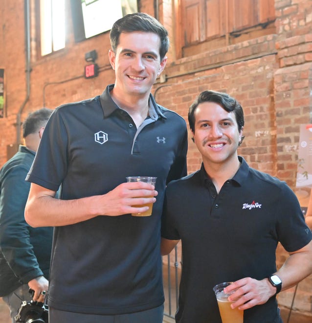 Paul Tyson, Marco Carrizales at the West End Social networking event at New Realm Brewing Co. in Downtown Greenville. Young professionals in the Greenville area connected with West End business owners and community leaders over delicious food and drink. Partners for the event included RingoFire, TALK Greenville magazine, Modal Coffee & Hostel, Corsica Technologies, Greenville Bike Taxi and Clayton's Deli.