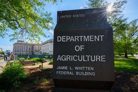 black sign saying ‘Department of Agriculture’ in front of a building