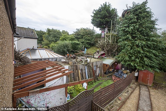 Viewing: The back garden dumping ground of ¿art work¿ at the property in a desirable area of Dalgety Bay in Fife