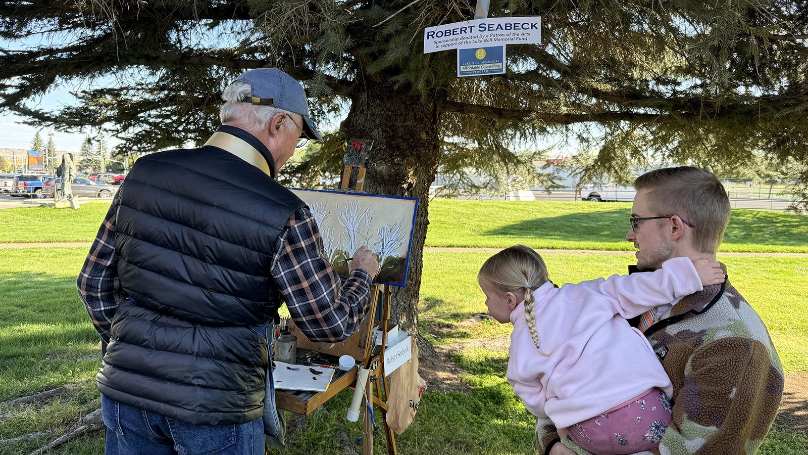 A child intently watched Robert Seabeck work on 