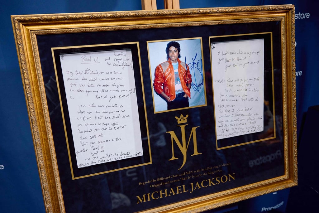 Framed Beat It lyrics, handwritten by Michael Jackson, will go under the hammer on November 15 during the Propstore auction. Photo: AFP