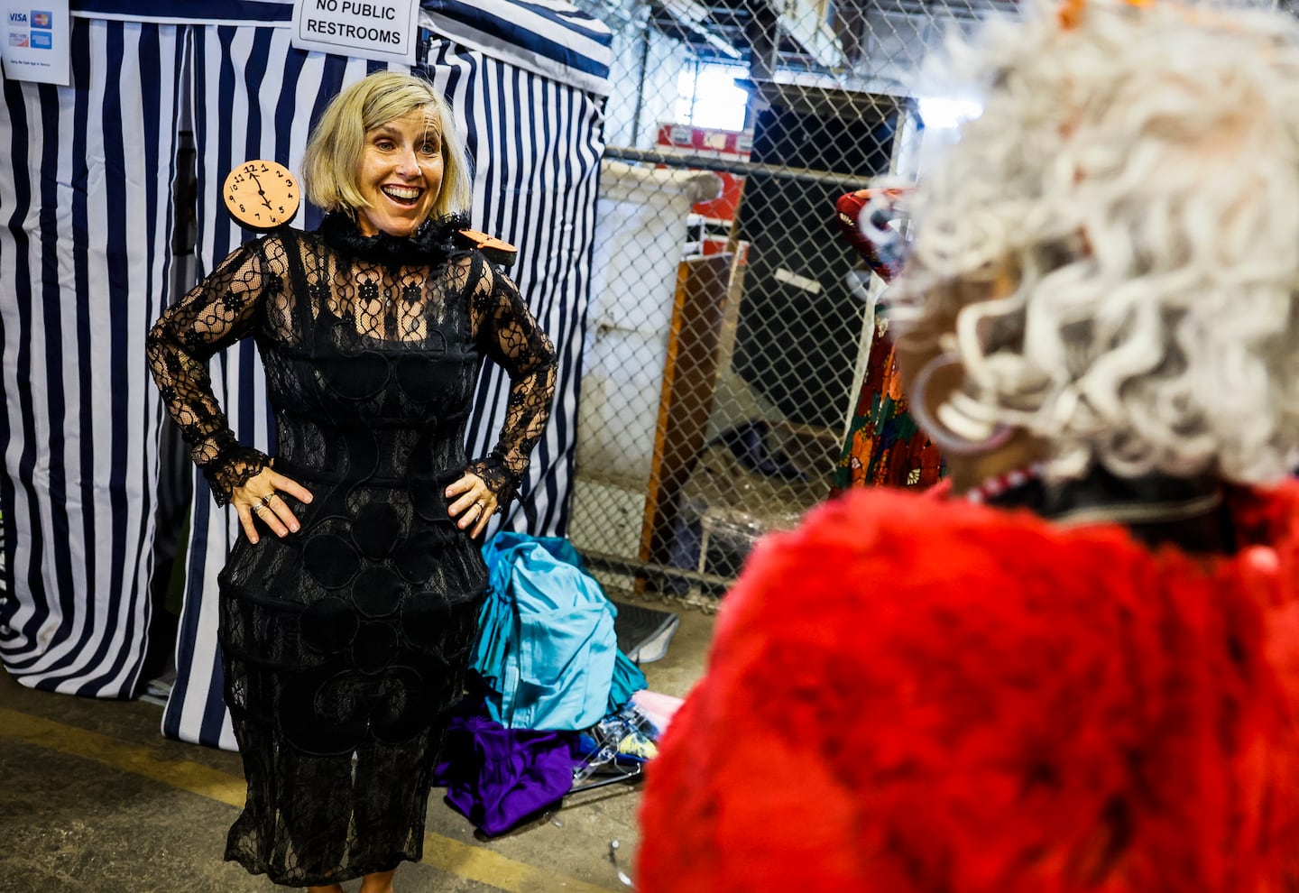 Michele Ferrari tries on a black lace costume during the American Repertory Theater's costume sale in Cambridge.