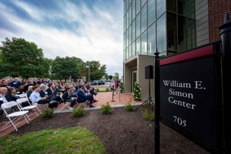 View of the dedication of the Simon Center dedication. The crowd is seated and President Hurd is at a podium.