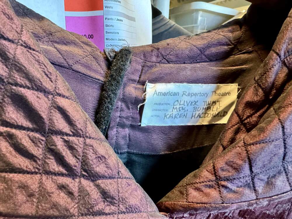 A close-up of the tag in Karen MacDonald’s purple coat from “Oliver Twist.” (Maddie Browning/WBUR)