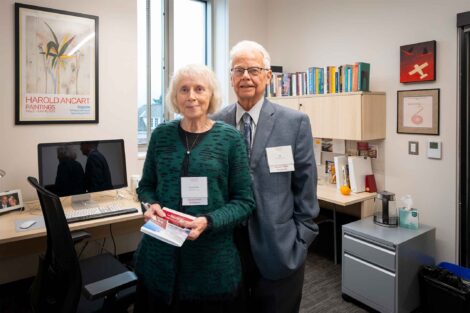 Alfred S. Pierce ’68 and Linda Mae Pierce are standing in an office and smiling at the camera.